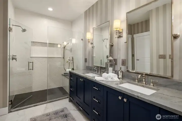 Quartzite countertops, dual vanities and pampering re-imagined shower