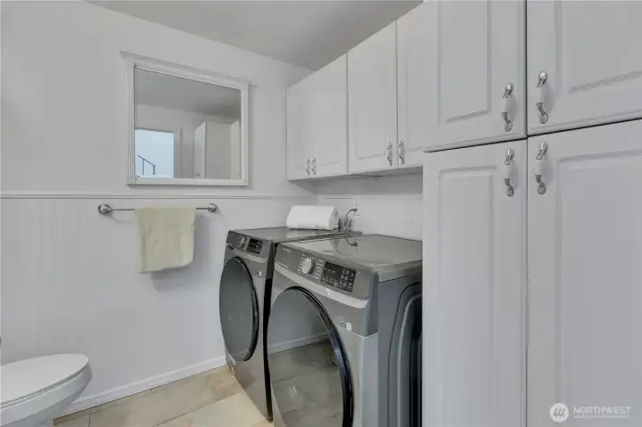 Laundry comes with plenty of storage.  Large W/D included with sale.