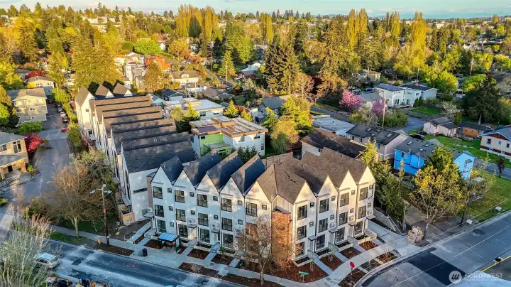 Aerial view of Elm showing off its charming gable architecture and ideal corner location—steps from neighborhood parks, dining, and shopping!