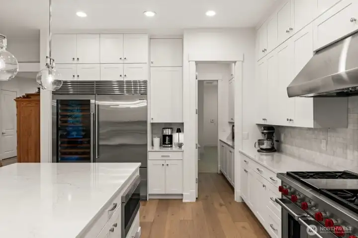 Through the doors to the pantry and small appliance station- then trough to the laundry room- SO good