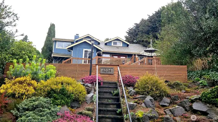 Tucked above the road with terraced landscaping and gated entry.