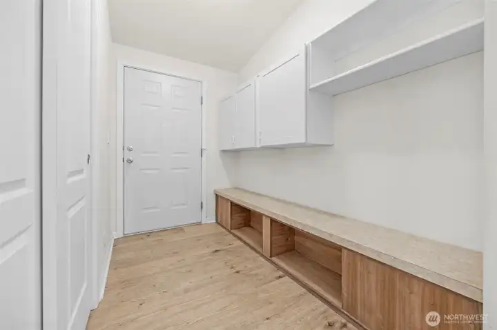 The door goes to the 1 car garage. Lots of storage in this drop zone.