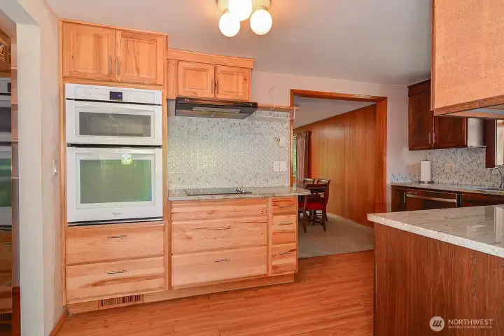 Kitchen with Granite Countertops, modern appliances & lots of cupboards & drawers.