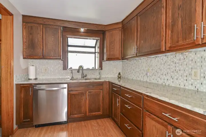 Kitchen also features backsplash and a window box.