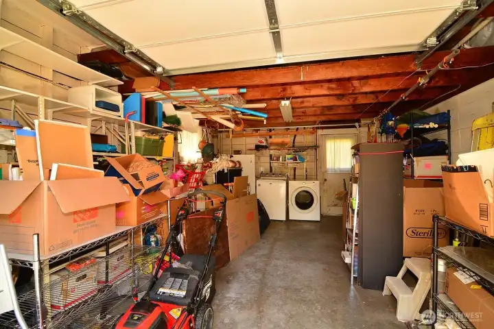 Garage with quiet automatic door & upper storage area.