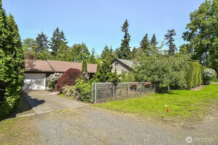 Private driveway with gate and extra parking in front.