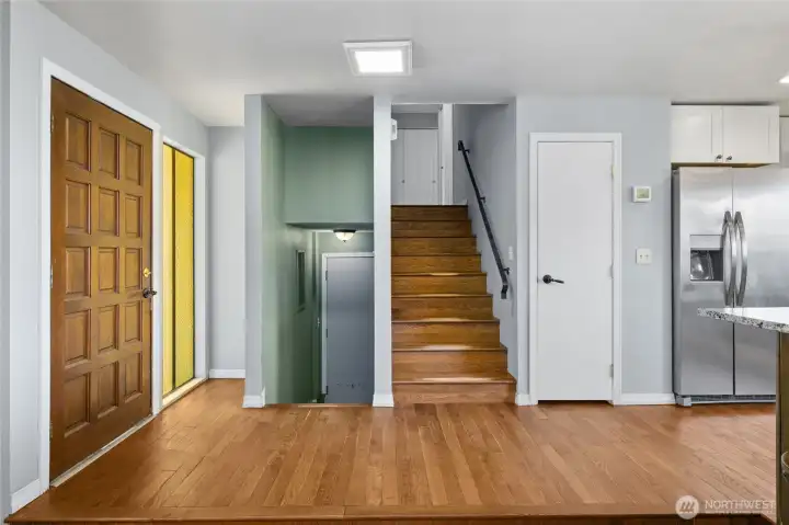 Entry area with access to garage, basement, and second story.