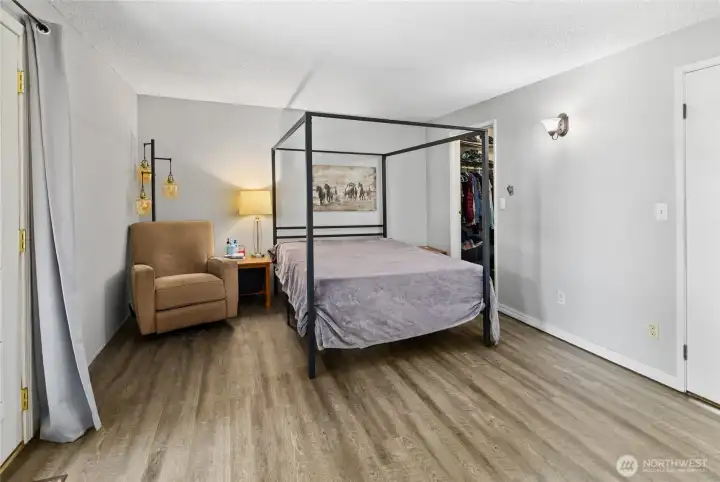 Walk in closet in primary bedroom.