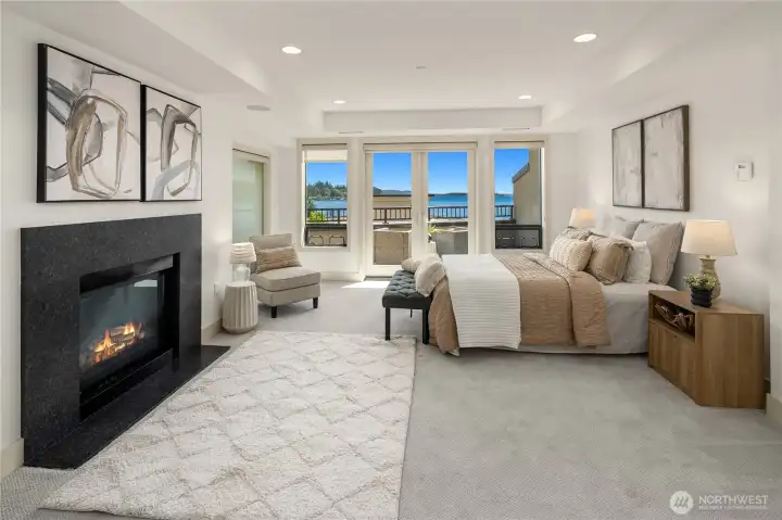 The primary bedroom has a gorgeous fireplace, view and deck.