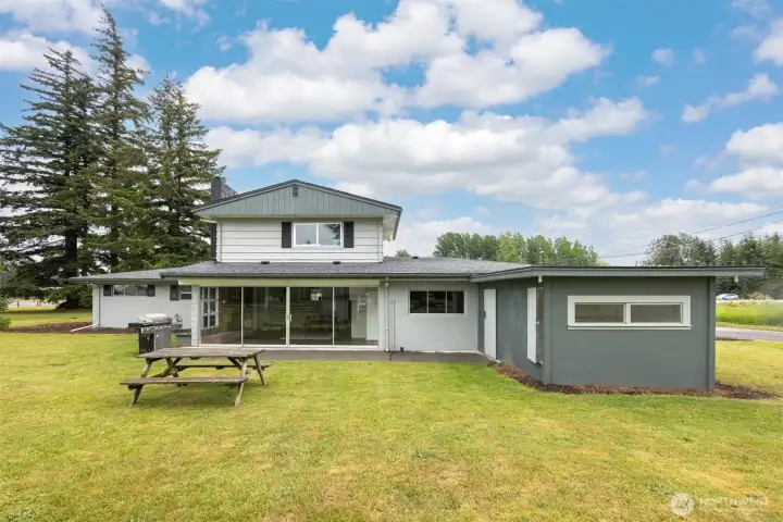 Back yard is spacious area for outdoor activity, with easy access storage for outdoor items. Back yard is spacious area for outdoor activity, with easy access storage for outdoor items.