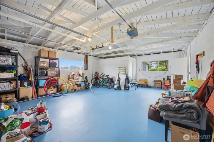 This garage makes a great at home workout area or tidy place to park vehicles. High ceiling and exposed beams add character and comfort this useful, clean space. This garage makes a great at home workout area or tidy place to park vehicles. High ceiling and exposed beams add character and comfort this useful, clean space.