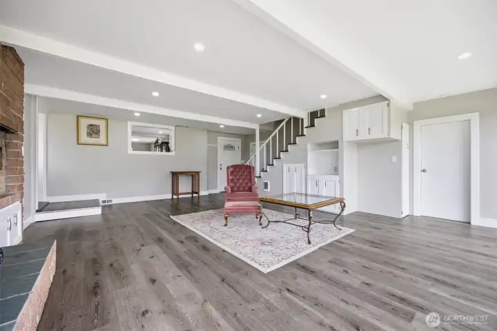 This "great room", light and bright with lots of living potential. Cozy wood burning fireplace for a warm spot to curl up in. This "great room", light and bright with lots of living potential. Cozy wood burning fireplace for a warm spot to curl up in.