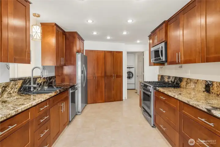 Updated kitchen, gas stove, with new dishwasher and refrigerator.