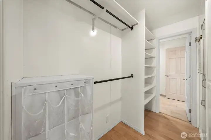 Walk-in closet of primary ensuite.
