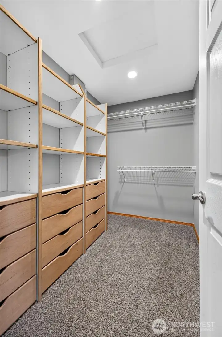 Walk-in closet with built in cabinetry Walk-in closet with built in cabinetry