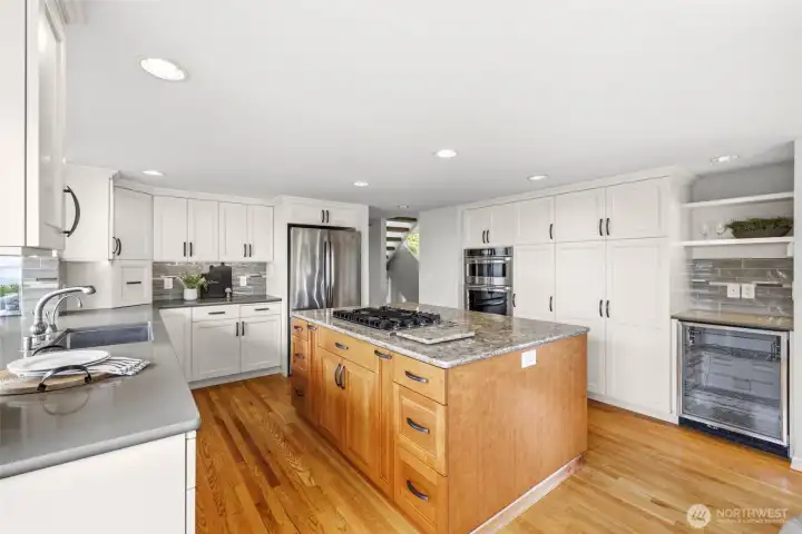 Quartz, stainless steel, wine cooler & more in this wonderful remodeled kitchen Quartz, stainless steel, wine cooler & more in this wonderful remodeled kitchen