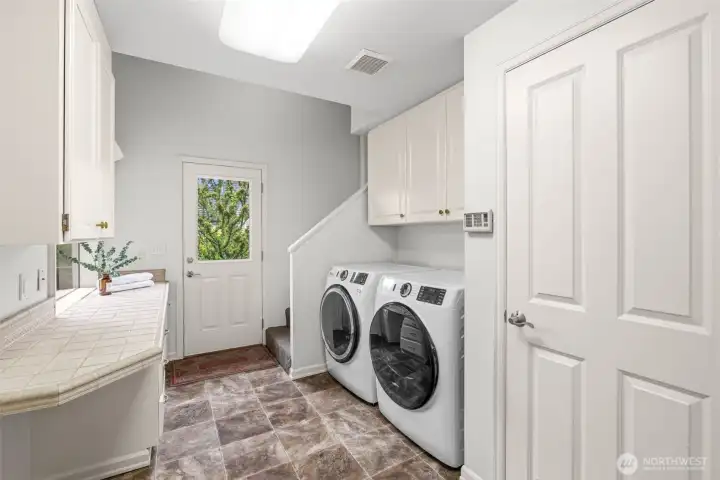 Main floor laundry room is massive, great storage too Main floor laundry room is massive, great storage too