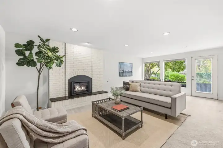 The rec room on lower level with gas fireplace opens to the lower patio and gorgeous yard The rec room on lower level with gas fireplace opens to the lower patio and gorgeous yard