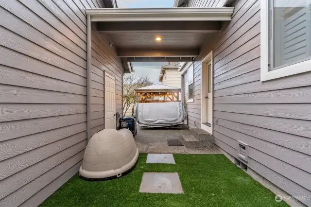 Covered walk way from garage to the house