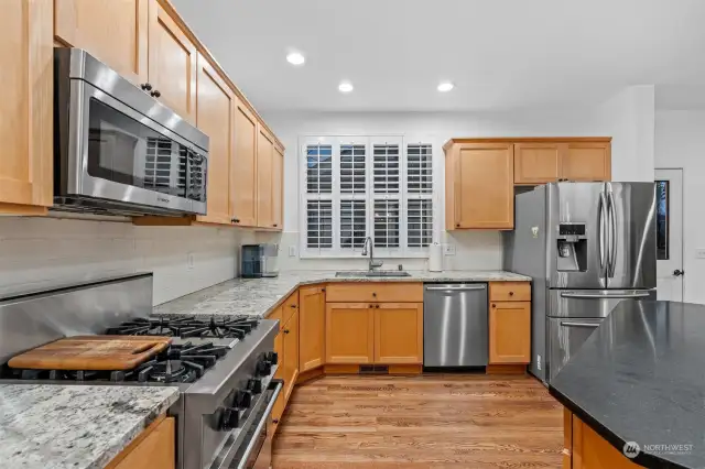 Kitchen features Granite counter tops, lots of Maple Cabinets, Hardwood floors and walk in pantry