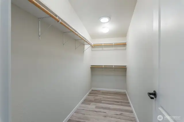primary bedroom closet with solatube