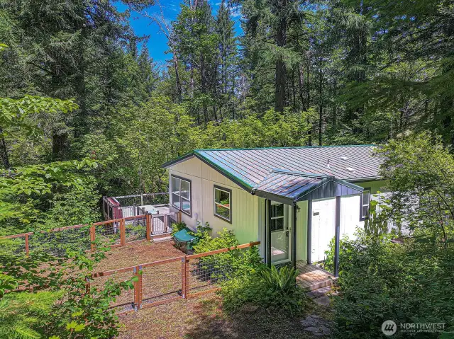 Front, fenced yard, deck with hot tub