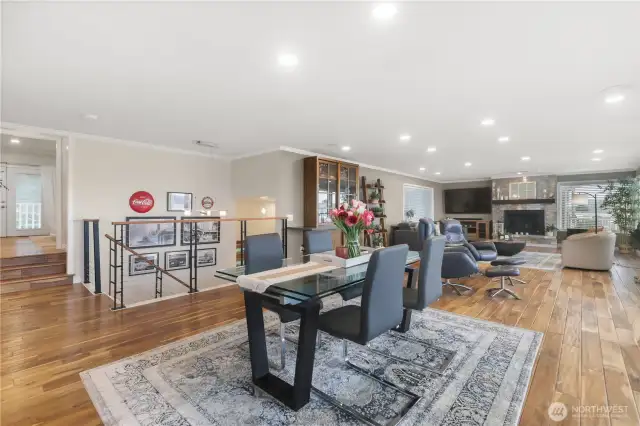 An open concept living space offers warmth, spaciousness, and seamless flow-a perfect blend of comfort and contemporary design. At the heart of the space is a beautiful gas fireplace serving as both a visual focal point and a cozy gathering spot.