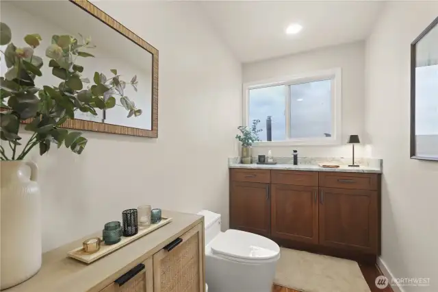 A modern half bath is a compact yet stylish space that makes a strong visual statement through clean lines, sleek materials, and smart design. Conveniently located on the main level off the kitchen/dining/livingroom area, perfect guests when entertaining.