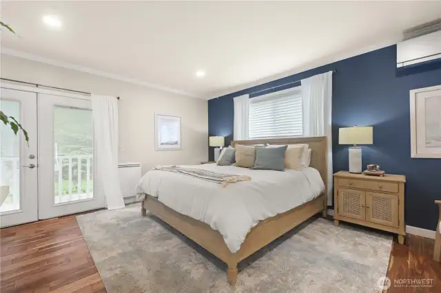 Upper level bedroom with French style doors adding so much charm and elegance to this space. Kept comfortably warm in the winter and refreshingly cool in the summer with it's own dedicated mini split.