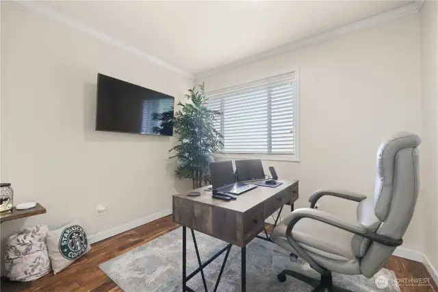 This small office is a cozy yet functional retreat, an extension of the main level bedroom. This would also make an excellent work out room!