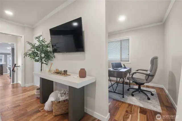 A small alcove just off the upper level bedroom is the perfect place for an office or a work out room.  Natural light from the window during the day and still being able to capture those water views.