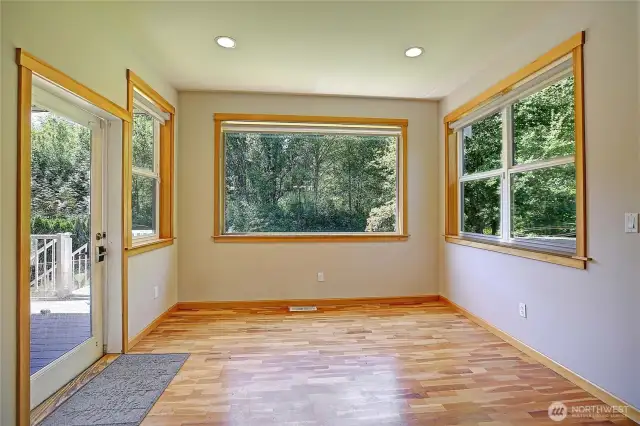 Dining area off kitchen with door to the heated back deck