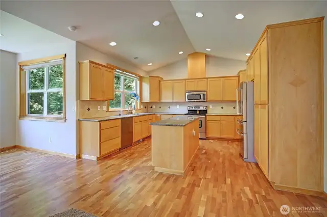 Large kitchen with stainless steel appliances, and granite countertops + beautiful hardwood floors