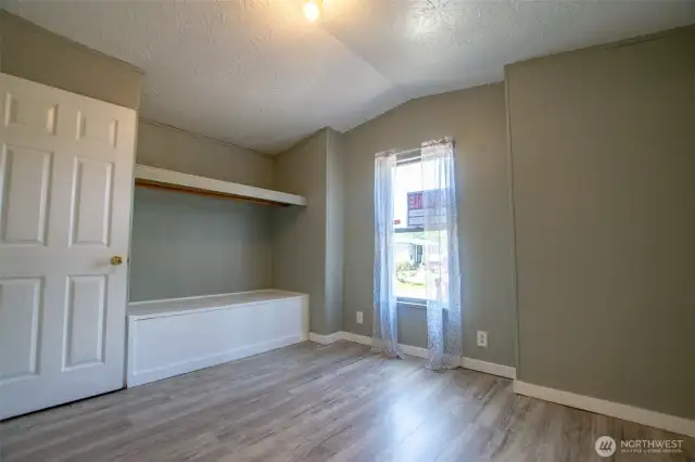 2nd bedroom w/ built-in bench.  Maybe a great space for a reading nook?