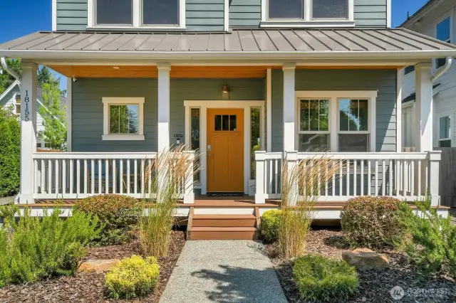 Cozy front porch with two sitting areas.