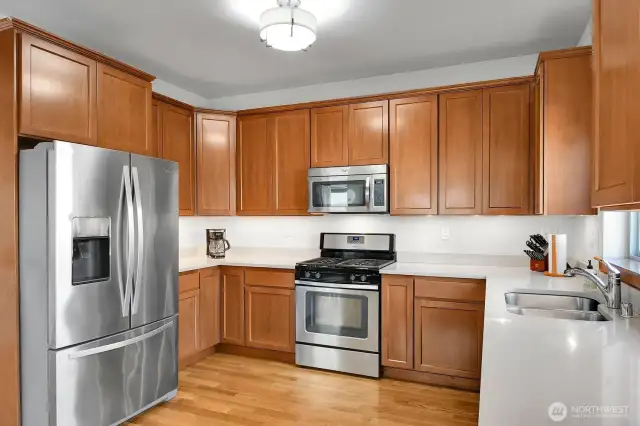 Lots of cabinet space, quartz counters, plus all appliances included.