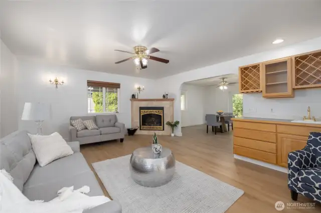 Large living room space for gathering connects with the dining room.