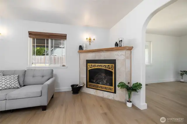 Natural gas fireplace makes the living room area feel cozy and warm.