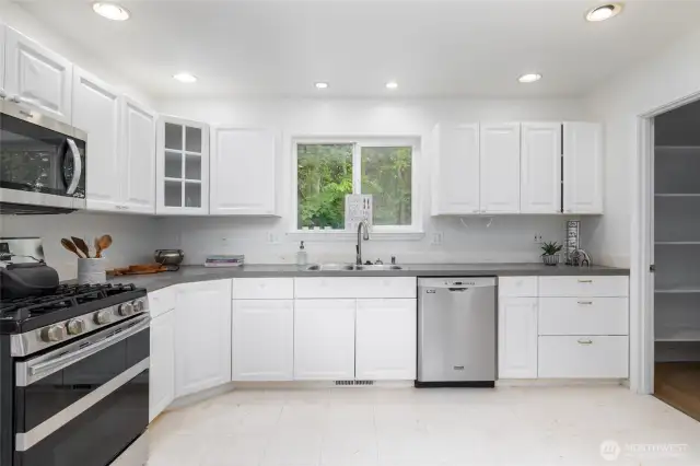 Two large pantries add to the enormous storage solutions in this kitchen.