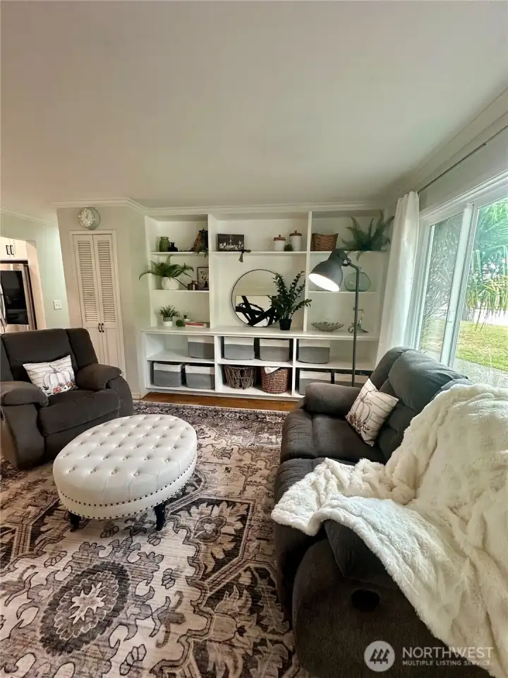 Upon entering the front door you're greeted with custom built-ins in the living space.