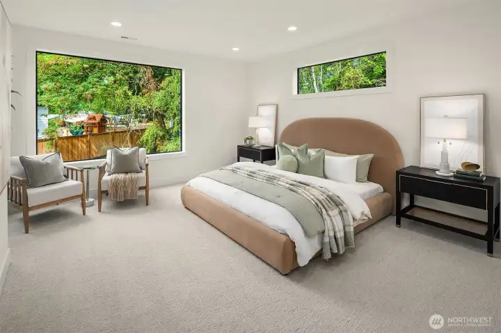 Designer primary suite with five-piece bath with heated floors