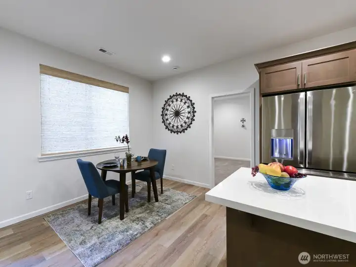 Separate Dining area. Vinyl plank flooring and white trim package.