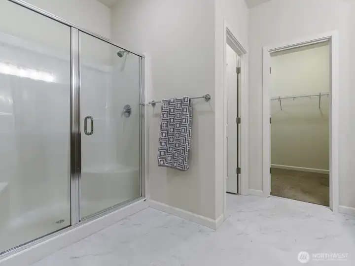 Primary has separate toilet area.  Nice sized shower with glass shower doors was upgrade.