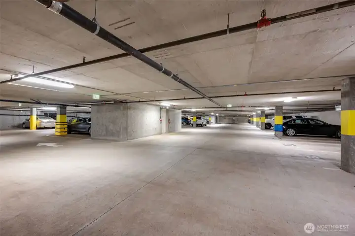 Two large, side by side parking spaces near the elevator
