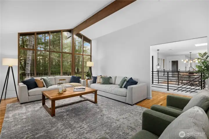 Light-filled gathering space with vaulted ceilings and multiple seating areas—ideal for everyday living and entertaining.