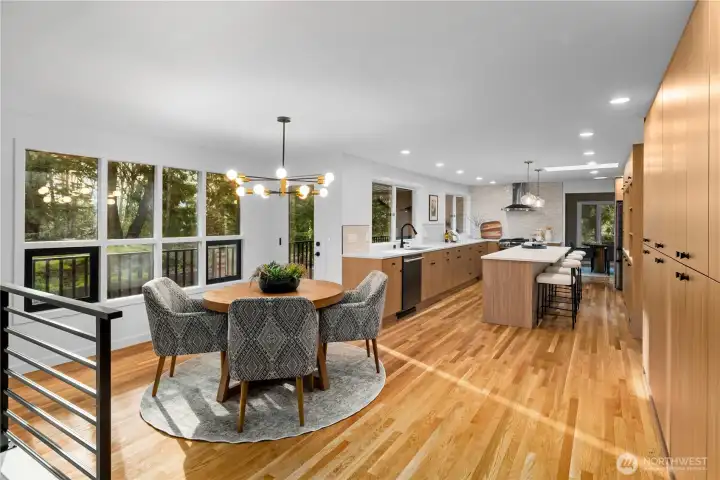 Fully renovated kitchen with custom cabinetry, quartz countertops, tile backsplash, and new appliances, designed for both functionality and style.