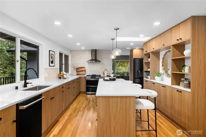 Fully remodeled kitchen featuring custom cabinetry, quartz countertops, and a spacious island designed for modern living.