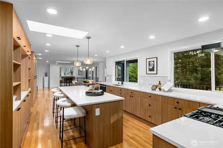 Extensive cabinetry and built-in storage provide functionality while maintaining a clean, modern aesthetic.