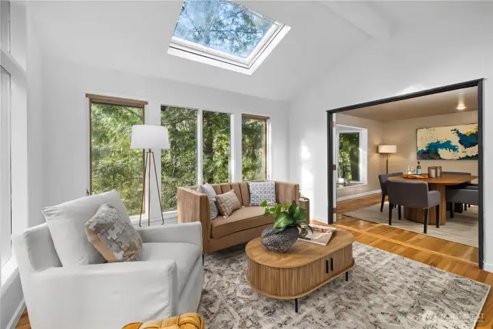 Light-filled sitting area with expansive windows and serene views—an ideal retreat for morning coffee or a quiet moment at the end of the day.