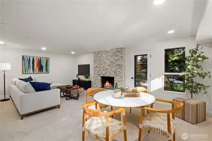 Spacious lower-level gathering area with refreshed fireplace, updated finishes, and room to relax, host, or unwind at the end of the day.